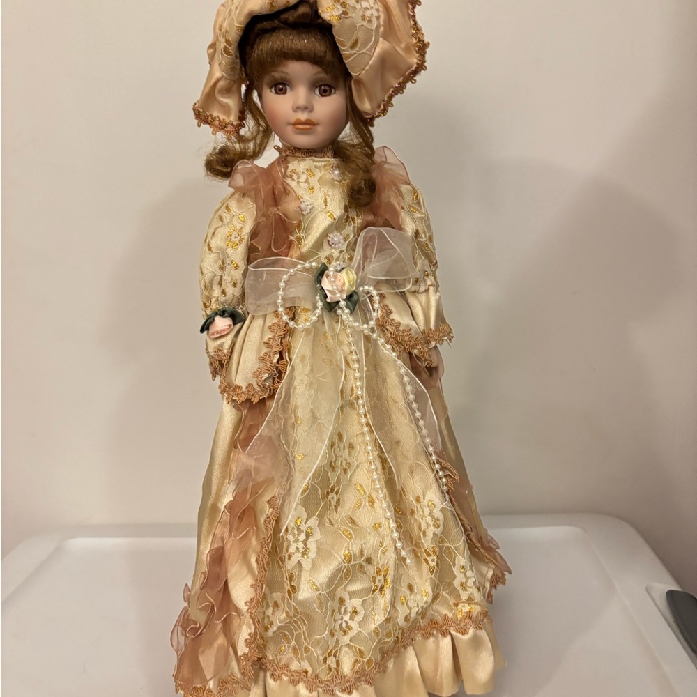 Elegant Cream and Tan Porcelain Doll